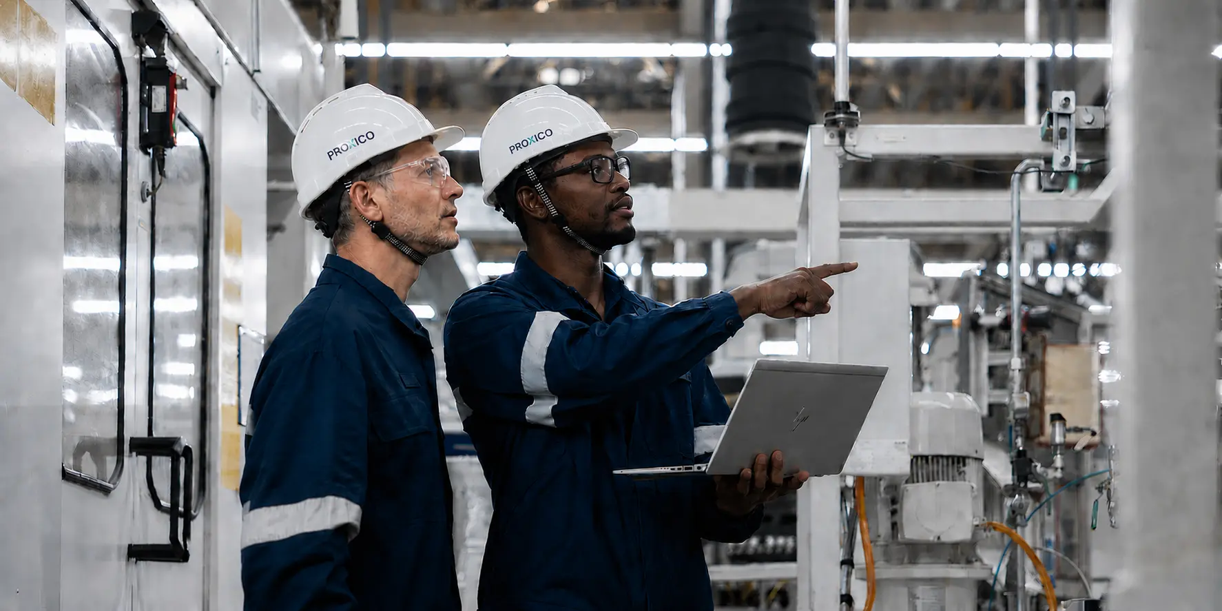 Proxico engineers assessing industrial equipment during a technical site visit in Kenya