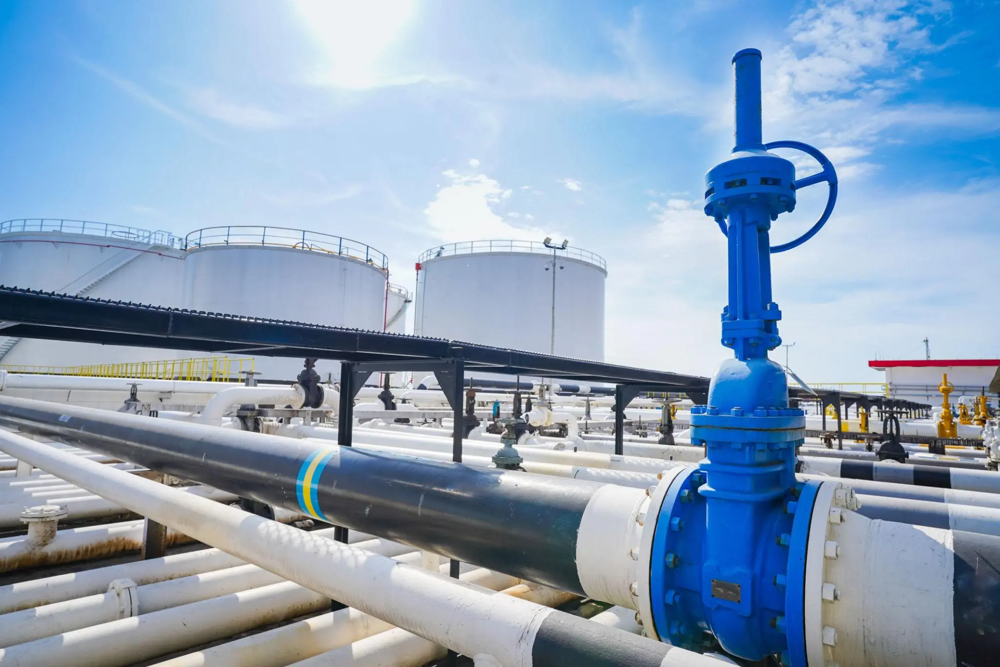 Industrial valve installation at an oil and gas storage terminal.